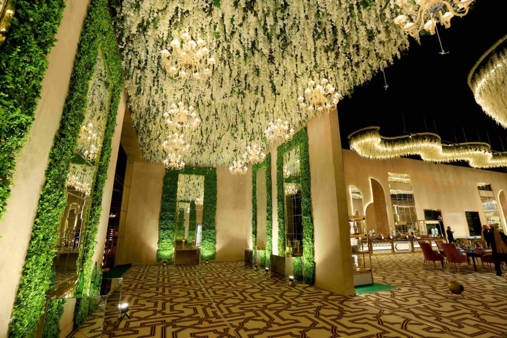 Foyer with green walls and floral ceiling
