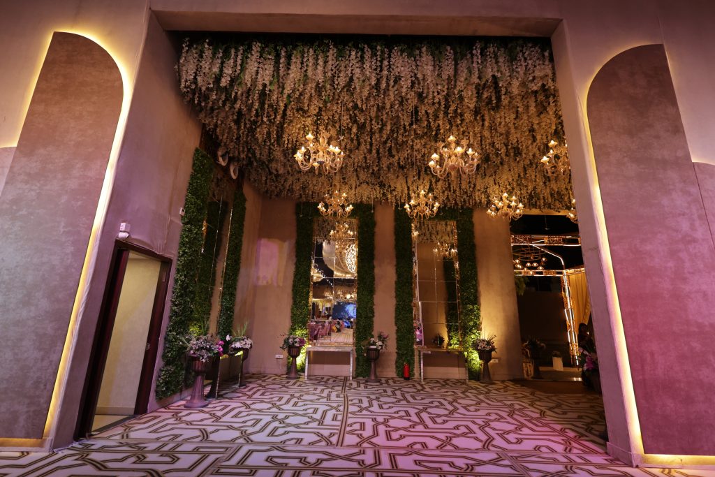 Foyer with green walls and a floral ceiling