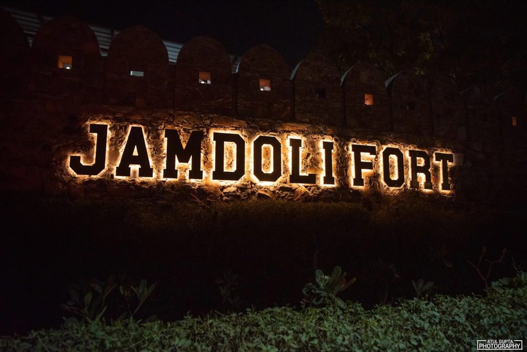 Jamdoli Fort sign lit at night
