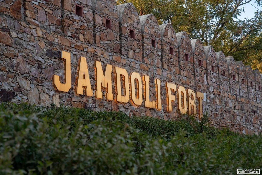 Jamdoli Fort sign on the fort-inspired wall